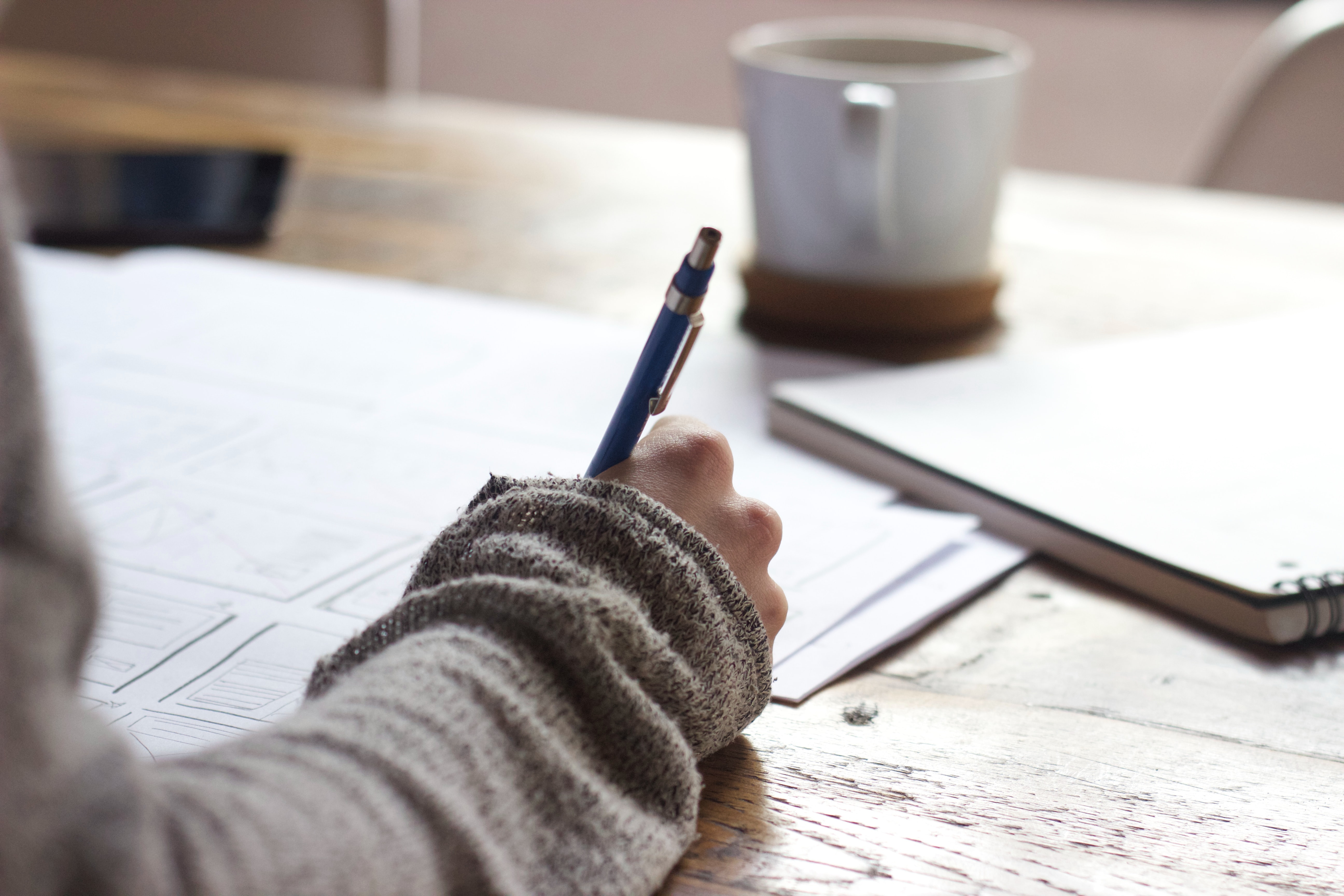 A notebook and pencil on a desk